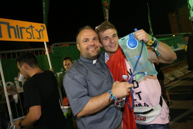 Croatia - A priest at the "Ultra Festival". To give living water
